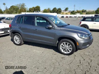 2014 Volkswagen Tiguan SEL with VIN WVGAV3AX8EW585929, listed as a Copart auction lot 61462205 with 63,899 mi miles and Salvage title. Bid and sale history available at DreamBid. Image 4.