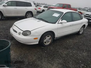 1999 Ford Taurus SE z VIN 1FAFP53U5XA269767, wystawiony jako IAAI lot #41504302 z przebiegiem 182 198 mil mil oraz . Historia ofert i sprzedaży dostępna na DreamBid. Obrazek 2.