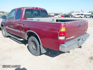 2002 Toyota Tundra SR5 with VIN 5TBRT34142S259456, listed as a IAAI auction lot 41872370 with 256,850 mi miles. Bid and sale history available at carsss.com. Image 3.