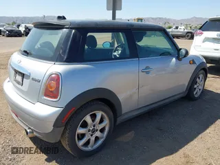 2007 MINI Hardtop with VIN WMWMF33547TL77235, listed as a IAAI auction lot 42547245 with 144,179 mi miles and . Bid and sale history available at DreamBid. Image 4.