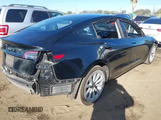 2022 Tesla Model 3 with VIN 5YJ3E1EA9NF295890, listed as a IAAI auction lot 41175917 with 42,230 mi miles and . Bid and sale history available at DreamBid. Image 4.