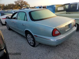 2005 Jaguar XJ with VIN SAJWA79C05SG37189, listed as a Copart auction lot 76804104 with 0 mi miles and Salvage Title. Bid and sale history available at carsss.com. Image 2.
