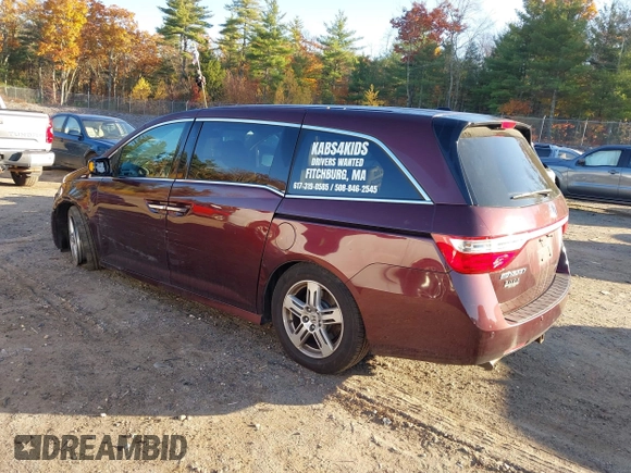 2012 Honda Odyssey Touring with VIN 5FNRL5H9XCB067841, listed as a IAAI auction lot 40631672 with 210,237 mi miles and . Bid and sale history available at DreamBid. Image 3.