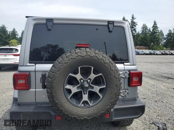 2018 Jeep Wrangler Unlimited Sahara with VIN 1C4HJXEG9JW231976, listed as a Copart auction lot 62427345 with 54,127 mi miles and Salvage title. Bid and sale history available at DreamBid. Image 6.