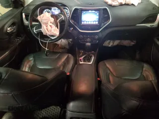 2014 Jeep Cherokee Trailhawk with VIN 1C4PJMBS0EW308775, listed as a Copart auction lot 60465125 with 117,326 mi miles and Salvage title. Bid and sale history available at DreamBid. Image 8.