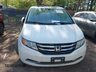 2014 Honda Odyssey EX-L with VIN 5FNRL5H63EB064854, listed as a IAAI auction lot 42102704 with 148,536 mi miles and . Bid and sale history available at carsss.com. Image 12.