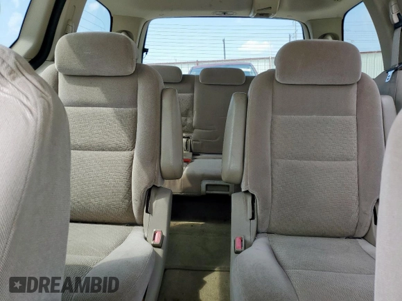 2004 Ford Freestar SEL z VIN 2FMZA52214BA84555, wystawiony jako Copart lot #54569535 z przebiegiem Nie podano mil oraz Szkoda całkowita • Salvage title. Historia ofert i sprzedaży dostępna na DreamBid. Obrazek 10.