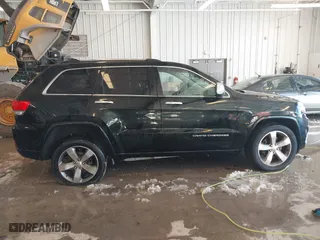 2014 Jeep Grand Cherokee Overland with VIN 1C4RJFCT7EC187319, listed as a IAAI auction lot 41256107 with 98,287 mi miles. Bid and sale history available at carsss.com. Image 13.