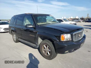 2000 Cadillac Escalade z VIN 1GYEK13R0YR167895, wystawiony jako Copart lot #82586443 z przebiegiem 267 099 mil mil oraz Szkody całkowita. Historia ofert i sprzedaży dostępna na DreamBid. Obrazek 4.