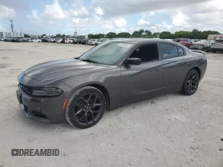2019 Dodge Charger SXT with VIN 2C3CDXBG6KH501370, listed as a Copart auction lot 61750525 with 74,087 mi miles and Salvage title. Bid and sale history available at DreamBid. Image 1.