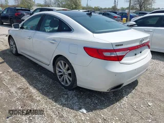 2014 Hyundai Azera Limited z VIN KMHFH4JG2EA373608, wystawiony jako IAAI lot #42125063 z przebiegiem 121 111 mil mil oraz . Historia ofert i sprzedaży dostępna na DreamBid. Obrazek 3.