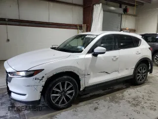 2018 Mazda CX-5 Touring z VIN JM3KFBCM6J0471242, wystawiony jako Copart lot #59702795 z przebiegiem 94 784 mil mil oraz Szkoda całkowita • Salvage title. Historia ofert i sprzedaży dostępna na DreamBid. Obrazek 1.