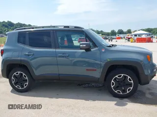 2015 Jeep Renegade Trailhawk with VIN ZACCJBCT8FPB33586, listed as a IAAI auction lot 42590207 with 127,168 mi miles and . Bid and sale history available at DreamBid. Image 13.