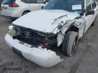2006 Ford Police Interceptor with VIN 2FAHP71W76X102230, listed as a IAAI auction lot 41229172 with 113,899 mi miles. Bid and sale history available at carsss.com. Image 6.