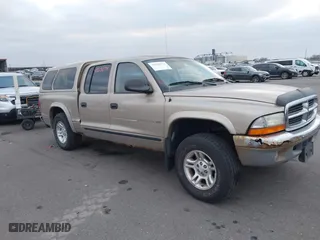 2002 Dodge Dakota SLT with VIN 1B7HG48N32S663205, listed as a IAAI auction lot 41125874 with 186,761 mi miles. Bid and sale history available at carsss.com. Image 1.