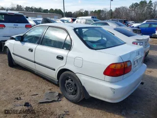2000 Honda Civic LX with VIN JHMEJ6672YS009310, listed as a IAAI auction lot 41542202 with 143,337 mi miles. Bid and sale history available at carsss.com. Image 3.