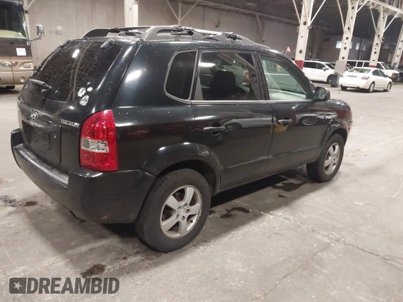 2006 Hyundai Tucson GL with VIN KM8JM12B26U325338, listed as a IAAI auction lot 41809578 with 127,210 mi miles. Bid and sale history available at carsss.com. Image 4.