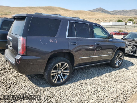2018 GMC Yukon Denali with VIN 1GKS2CKJXJR217857, listed as a Copart auction lot 62943934 with 122,015 mi miles and Salvage Title. Bid and sale history available at carsss.com. Image 3.