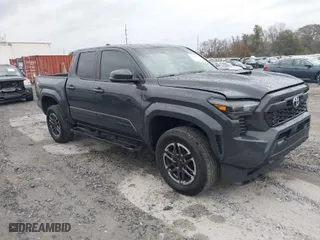 2024 Toyota Tacoma 2WD SR5 with VIN 3TYKB5FN1RT007010, listed as a IAAI auction lot 41026642 with 13,386 mi miles. Bid and sale history available at carsss.com. Image 1.