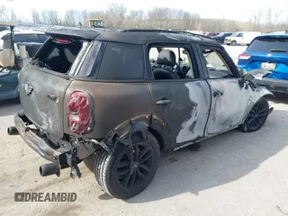 2014 MINI Countryman S with VIN WMWZC3C55EWT00416, listed as a IAAI auction lot 42031870 with Not Provided miles and . Bid and sale history available at DreamBid. Image 4.