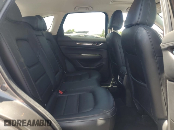 2018 Mazda CX-5 Grand Touring with VIN JM3KFADM3J1389911, listed as a Copart auction lot 60530295 with 103,177 mi miles and Salvage title. Bid and sale history available at DreamBid. Image 11.