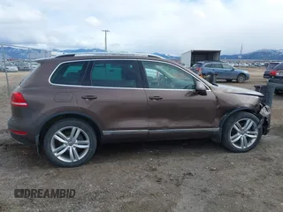 2013 Volkswagen Touareg Lux with VIN WVGEF9BP1DD012851, listed as a IAAI auction lot 41732391 with 123,283 mi miles and . Bid and sale history available at DreamBid. Image 14.