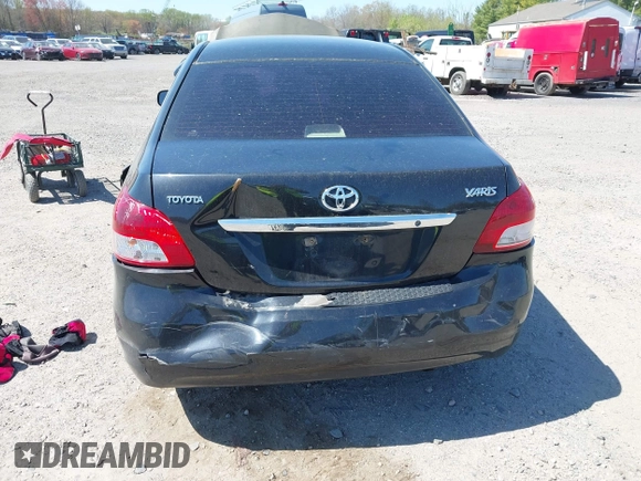 2009 Toyota Yaris with VIN JTDBT903294057773, listed as a IAAI auction lot 42071027 with 164,128 mi miles. Bid and sale history available at carsss.com. Image 6.