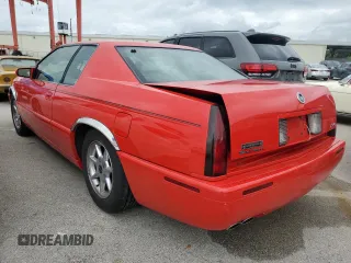 2002 Cadillac Eldorado z VIN 1G6EC129X2B106142, wystawiony jako Copart lot #74424164 z przebiegiem Nie podano mil oraz Szkody całkowita. Historia ofert i sprzedaży dostępna na DreamBid. Obrazek 2.