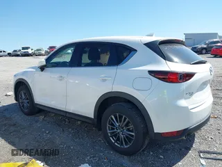2021 Mazda CX-5 Touring z VIN JM3KFBCM2M1395663, wystawiony jako IAAI lot #41948073 z przebiegiem 47 029 mil mil oraz . Historia ofert i sprzedaży dostępna na DreamBid. Obrazek 14.