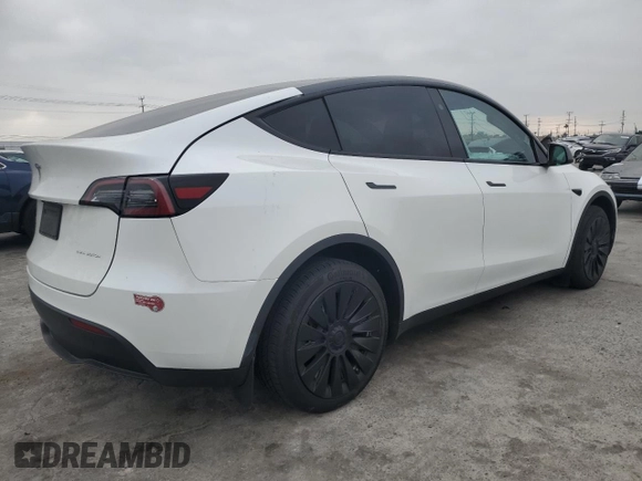 2023 Tesla Model Y Long Range with VIN 7SAYGDEE2PF860135, listed as a Copart auction lot 50380975 with 25,334 mi miles and Salvage Title. Bid and sale history available at DreamBid. Image 3.