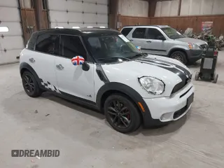 2012 MINI Countryman S with VIN WMWZC5C58CWL60067, listed as a IAAI auction lot 42081725 with 104,397 mi miles and . Bid and sale history available at DreamBid. Image 1.