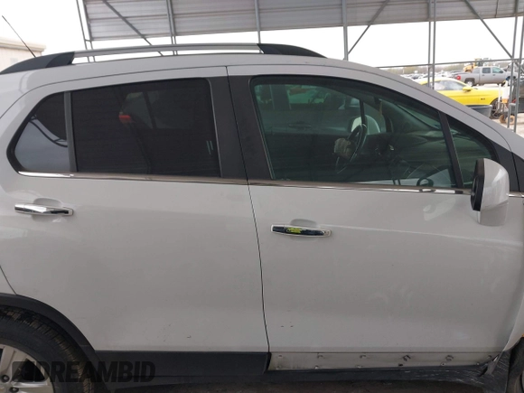 2020 Chevrolet Trax LT with VIN KL7CJLSBXLB010793, listed as a IAAI auction lot 41704879 with 124,915 mi miles and . Bid and sale history available at DreamBid. Image 13.