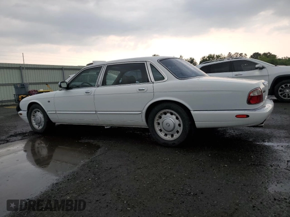 1999 Jaguar XJ with VIN SAJKD6041XC876928, listed as a Copart auction lot 60038405 with 63,917 mi miles and Clean title. Bid and sale history available at DreamBid. Image 2.