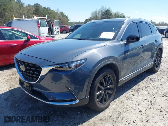 2021 Mazda CX-9 Carbon Edition with VIN JM3TCADY9M0517174, listed as a IAAI auction lot 41871485 with 48,484 mi miles and . Bid and sale history available at DreamBid. Image 2.