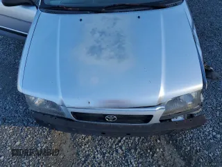 1997 Toyota Tercel CE z VIN JT2AC52L1V0227973, wystawiony jako Copart lot #77300554 z przebiegiem 301 799 mil mil oraz Szkoda całkowita • Salvage title. Historia ofert i sprzedaży dostępna na DreamBid. Obrazek 11.