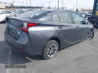 2020 Toyota Prius L Eco z VIN JTDKARFU9L3104882, wystawiony jako IAAI lot #41243035 z przebiegiem 29 013 mil mil oraz . Historia ofert i sprzedaży dostępna na DreamBid. Obrazek 4.