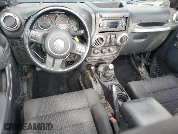 2011 Jeep Wrangler Rubicon with VIN 1J4BA6D12BL507652, listed as a Copart auction lot 69989964 with 127,493 mi miles and Salvage title. Bid and sale history available at DreamBid. Image 8.