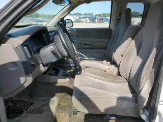 2001 Dodge Dakota z VIN 1B7GL22X21S128774, wystawiony jako Copart lot #58313685 z przebiegiem 167 355 mil mil oraz Czysty tytuł • Clean title. Historia ofert i sprzedaży dostępna na DreamBid. Obrazek 7.