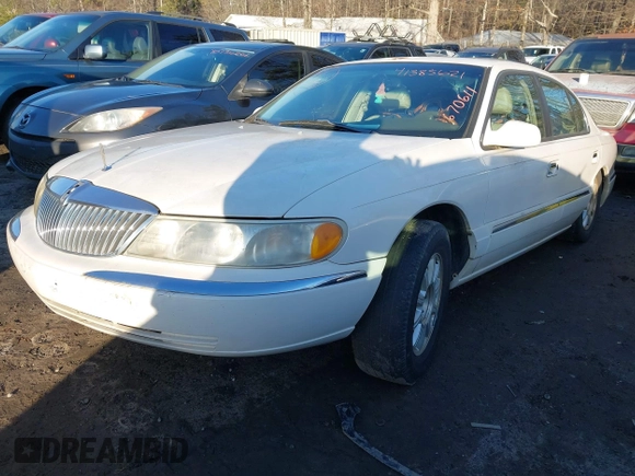 2001 Lincoln Continental with VIN 1LNHM97V71Y670611, listed as a IAAI auction lot 41385621 with 141,714 mi miles. Bid and sale history available at carsss.com. Image 2.
