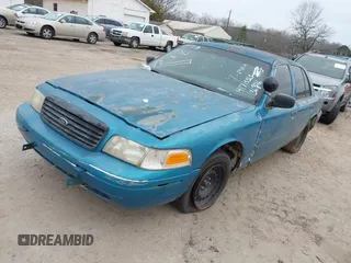 2000 Ford Crown Victoria Police Police Interceptor with VIN 2FAFP71W4YX136846, listed as a IAAI auction lot 41715363 with 335,956 mi miles. Bid and sale history available at carsss.com. Image 2.
