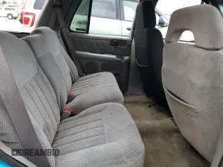 1995 Chevrolet Blazer z VIN 1GNDT13W4S2154787, wystawiony jako Copart lot #85719274 z przebiegiem 167 242 mil mil oraz Nie do naprawy • Non repairable. Historia ofert i sprzedaży dostępna na DreamBid. Obrazek 11.