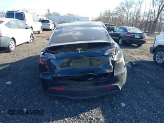 2025 Tesla Model Y Long Range with VIN 7SAYGDED7SF229722, listed as a IAAI auction lot 41330526 with 2,901 mi miles and . Bid and sale history available at DreamBid. Image 15.