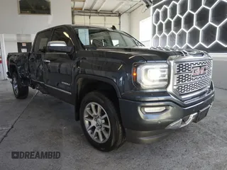 2017 GMC Sierra 1500 Denali z VIN 3GTU2PEJ2HG410828, wystawiony jako Copart lot #58846535 z przebiegiem 124 361 mil mil oraz Szkoda całkowita • Salvage title. Historia ofert i sprzedaży dostępna na DreamBid. Obrazek 1.