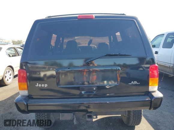 1998 Jeep Cherokee Sport with VIN 1J4FT68S8WL134461, listed as a Copart auction lot 74005704 with 0 mi miles and Salvage Title. Bid and sale history available at carsss.com. Image 6.
