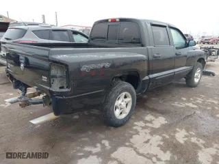2006 Dodge Dakota SLT with VIN 1D7HE48N16S611010, listed as a IAAI auction lot 41018277 with 182,335 mi miles. Bid and sale history available at carsss.com. Image 4.