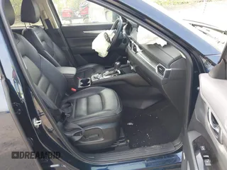 2021 Mazda CX-5 Touring z VIN JM3KFBCMXM0389857, wystawiony jako IAAI lot #42309650 z przebiegiem 49 938 mil mil oraz . Historia ofert i sprzedaży dostępna na DreamBid. Obrazek 5.