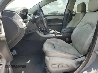 2014 Cadillac SRX Premium Collection z VIN 3GYFNGE30ES627895, wystawiony jako Copart lot #58605985 z przebiegiem 49 300 mil mil oraz Szkoda całkowita • Salvage title. Historia ofert i sprzedaży dostępna na DreamBid. Obrazek 7.