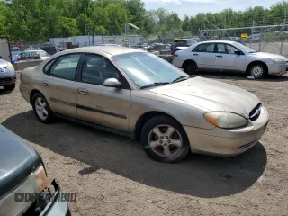 2001 Ford Taurus SE with VIN 1FAFP53U91G108049, listed as a Copart auction lot 55464715 with 85,748 mi miles and Salvage title. Bid and sale history available at DreamBid. Image 4.
