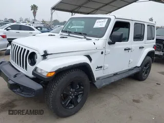2023 Jeep Wrangler Sahara with VIN 1C4HJXEG5PW581632, listed as a IAAI auction lot 42462622 with 24,550 mi miles and . Bid and sale history available at DreamBid. Image 2.