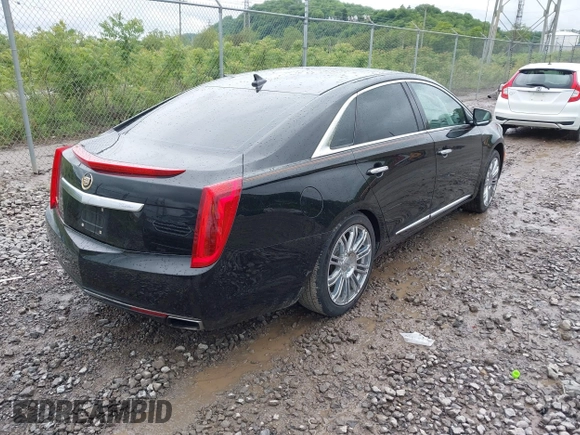 2014 Cadillac XTS Luxury with VIN 2G61M5S32E9231544, listed as a IAAI auction lot 42340088 with 74,518 mi miles and . Bid and sale history available at DreamBid. Image 4.